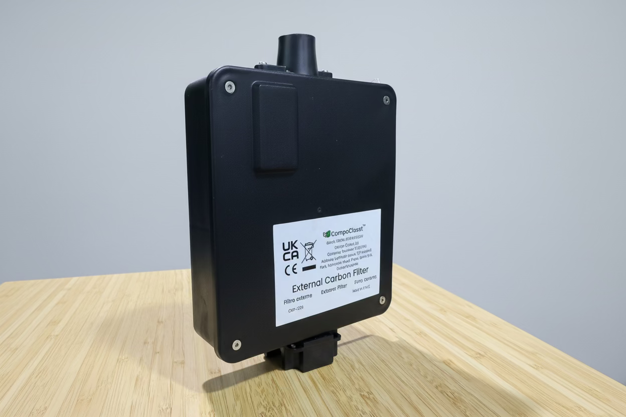 Venting carbon filter from Compo Closet Australia, showing the cylindrical filter with mesh and carbon media for odor control.